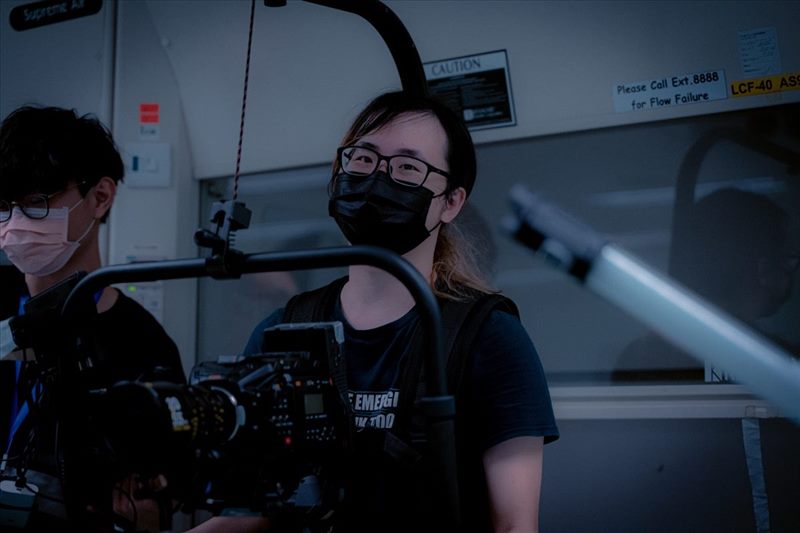 YU Kwan Yin Timothy operating a camera