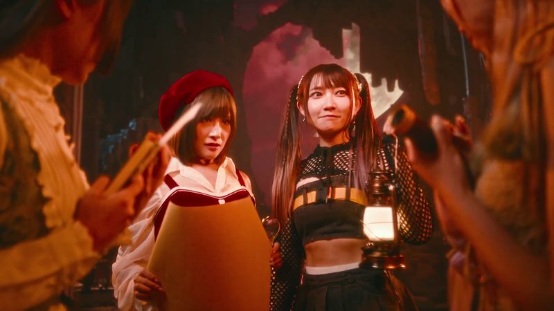 Still from Parallel Phantasia official music video with performers in warm fantasy lighting